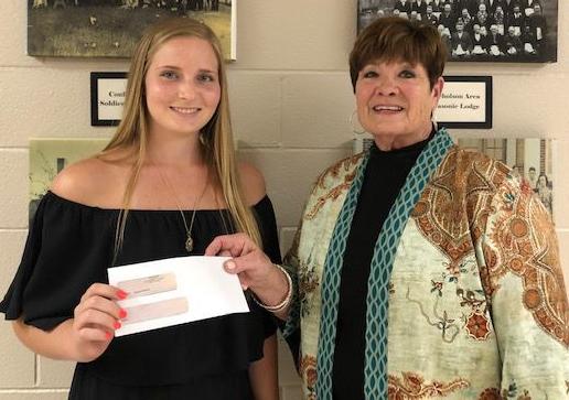 MALCOLM RECEIVES SCHOLARSHIP